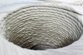 a large spool of white thread