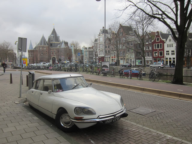 heaps of old Citro n DS sharks lumbering next to the historical canals