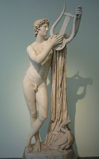 Greek God Apollo holding his Lyre.