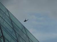 Military Helicopter next to glass pyramid of hidamari as seen at moerenuma Park (Moerenuma Koen), Sapporo