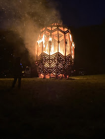 Wooden sculpture on fire.