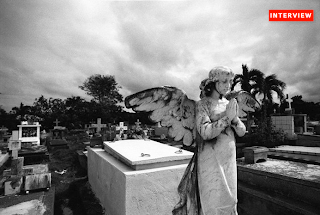 A praying Angel in a cemetery in Cuba photo by Marlon Krieger