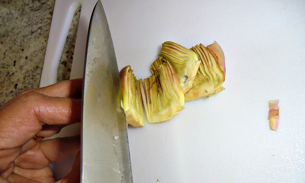 Thinly slice the artichokes