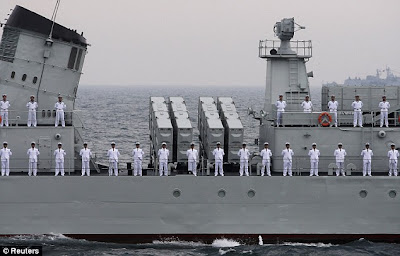 sailors lined up on parade on ship's deck