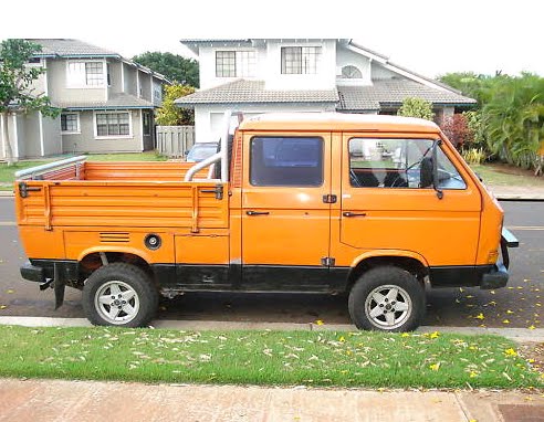 This is a Volkswagen Type 2 T3 Double Cab Doka Syncro truck