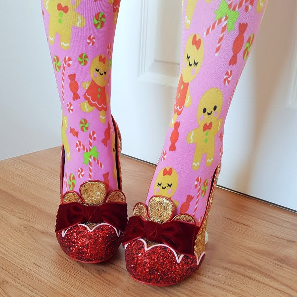 wearing pink gingerbread tights with gold and red glitter shoes with velvet bow