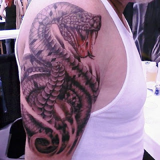 http://allaboutbodyart.blogspot.com/ rattlesnake_tattoo_designs_half_sleeve_tattoo_snakes