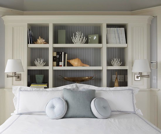 built-in bookcase headboard adds visual interest to this bedroom ...