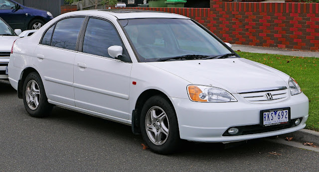 For a complete review of Honda Civic models, visit Honda Civic. The seventh generation Honda Civic is an automobile manufactured by Honda from 2000 to 2005. It debuted in September 2000 as a 2001 model. Its exterior dimensions remained the same as its outgoing predecessor, with a significant increase in interior space, relegating it to compact car size status. A notable feature was the flat rear floor which provided better comfort for rear seat passengers. This generation ditched the front double wishbone suspension, previously used in the fourth to sixth generation and replaced by MacPherson struts. This generation was the last to offer 4WD variants.  When introduced in 2000, it won the Car of the Year Japan award for a record fourth time. It also won the 2001 Japan Automotive Researchers and Journalists' Conference Car of the Year award.