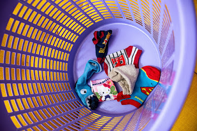 Laundry basket containing dirty socks