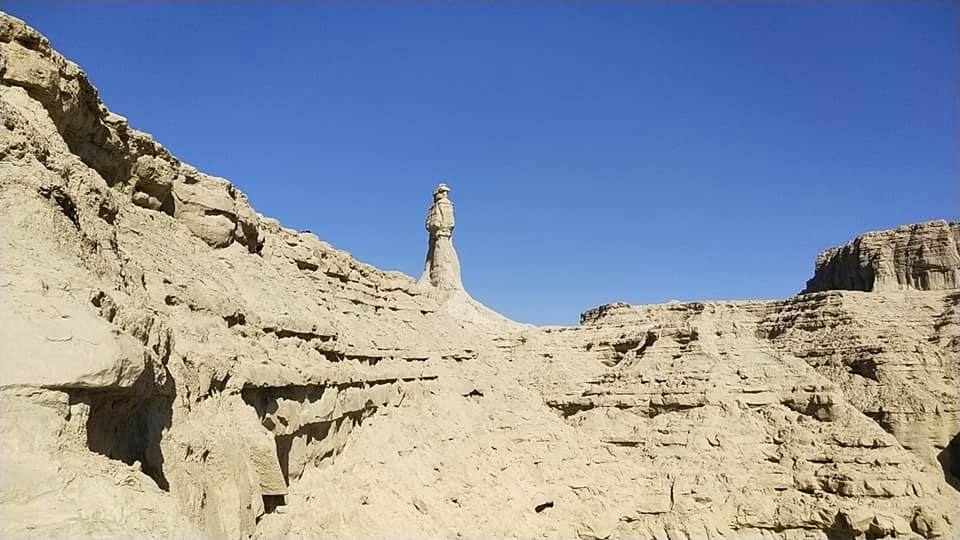 Princess of Hope Statue Makran Coast Highway. Angelina Jolie Pakistan. a statue of a tall woman looking for something in the distant horizon