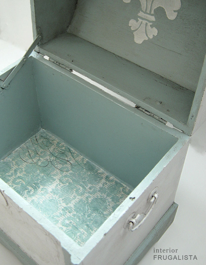 A small decorative trunk makeover with vintage-style distressed damask paper lined interior.