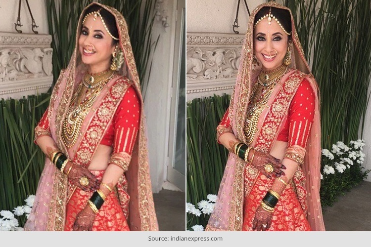 Urmila Matondkar Looks Majestic at her Wedding, Urmila Matondkar, the Rangeela girl went all red on her wedding day. She tied knot with Mohsin Akhtar Mir in a private ceremony yesterday in Mumbai. She looked as gorgeous as the hues of heaven. She looked picture perfect in the Manish Malhotra ensemble. The actress was the face of the designer for quite some time. He, who is also her closest friend, dressed her up in a beautiful tomato red and golden lehenga that is heavily embellished. He even had her chunar or the dupatta designed in detail for her grand event. She kept the jewellery heavy and traditional along with a maatha patti and didn’t forget to showcase her Marathi traditions with the green bangles. She looked angelic at her reception in a gold shimmering white suit. Her hair as always looked wavy adding grace to her gorgeous looks. All our love and best wishes to the sizzling actress on her new beginning. (Copied from Indian Fashion Blog)