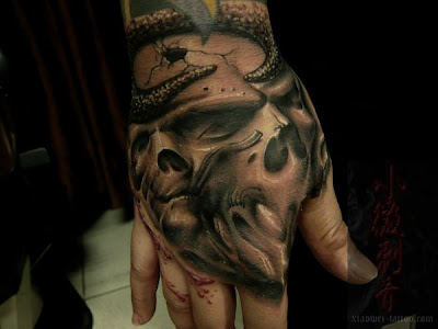 hand free tattoo design, skull tattoo designs