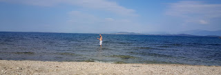 Giving a wave during my first foray into the sea