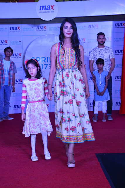 Models walking the ramp with the kids