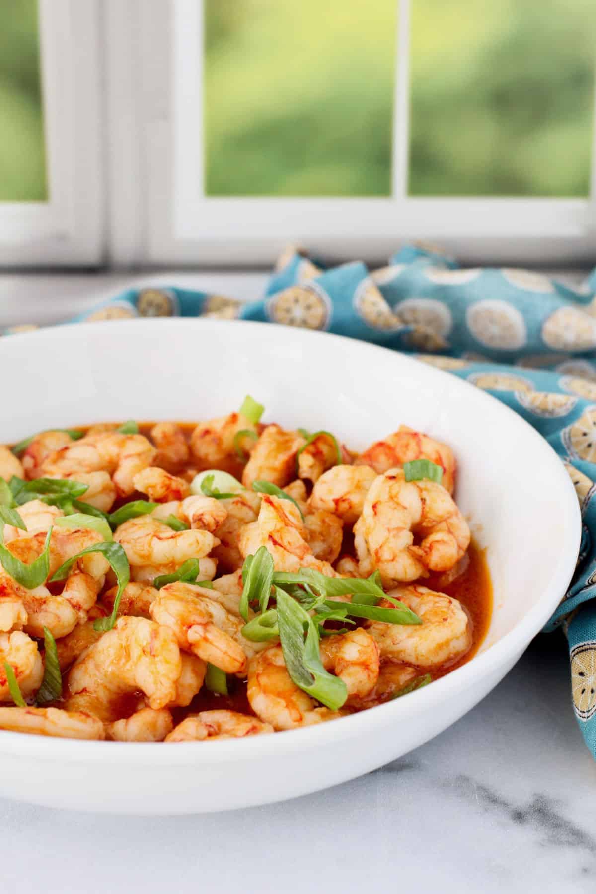 Singapore-Style Chili Garlic Shrimp in a white bowl.