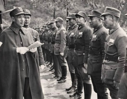Chiang Kai-Shek inspecting Chinese troops at new infantry training center in Kwangsi Province