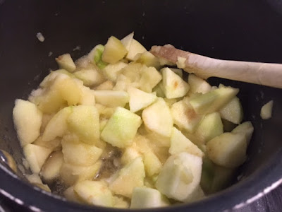 Apple and sugar in a pan