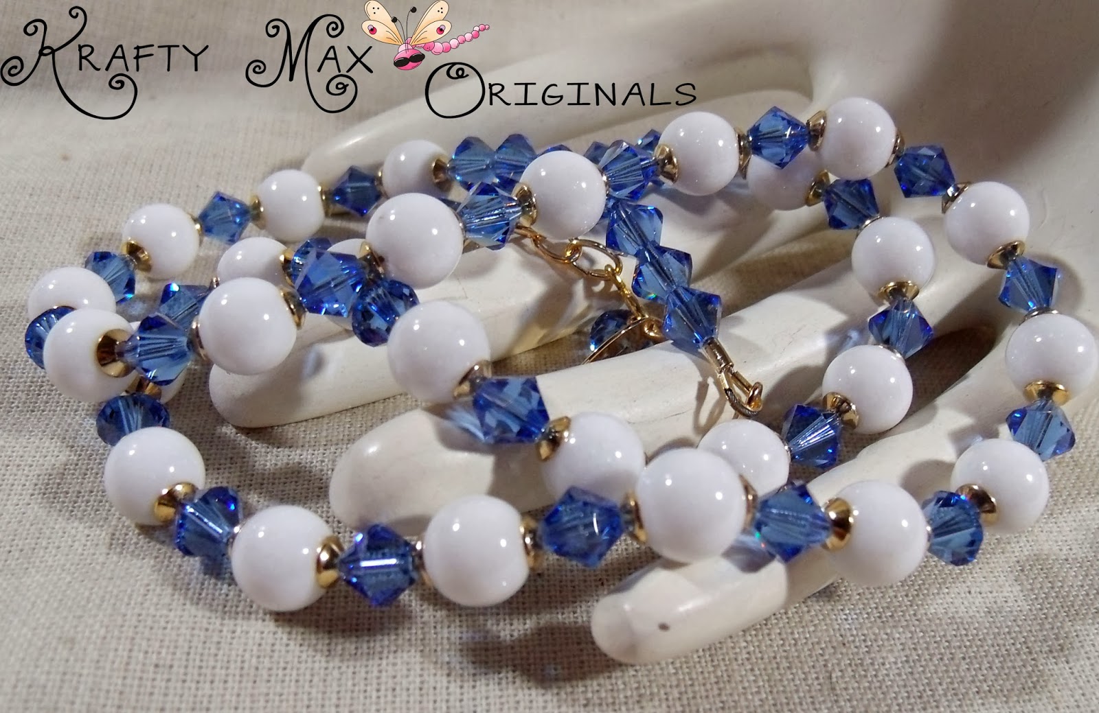 http://www.artfire.com/ext/shop/product_view/KraftyMax/8548358/white_mountain_jade_andamp_blue_swarovski_crystals_w_gold_plated_findings/handmade/jewelry/sets/crystal