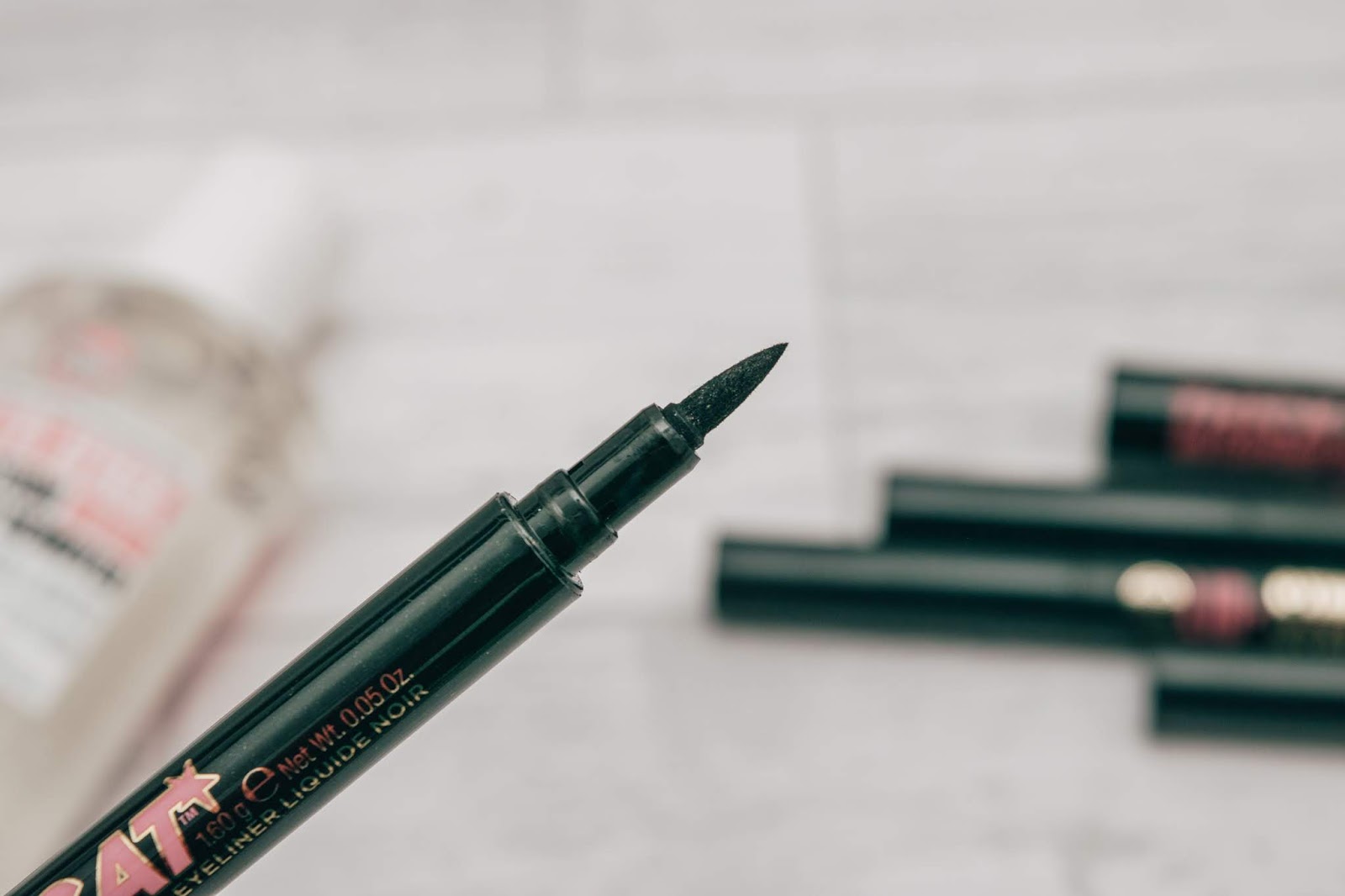 A close up of a black eyeliner pen