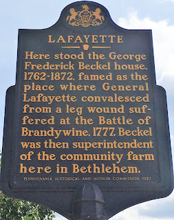 Lafayette. Here stood the George Frederick Beckel house, 1762-1872, famed as the place where General Lafayette convalesced from a leg wound suffered at the Battle of Brandywine, 1777. Beckel was then superintendent of the community farm here in Bethlehem.