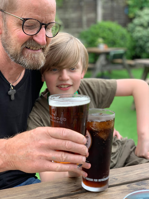 Dad and son in pub garden