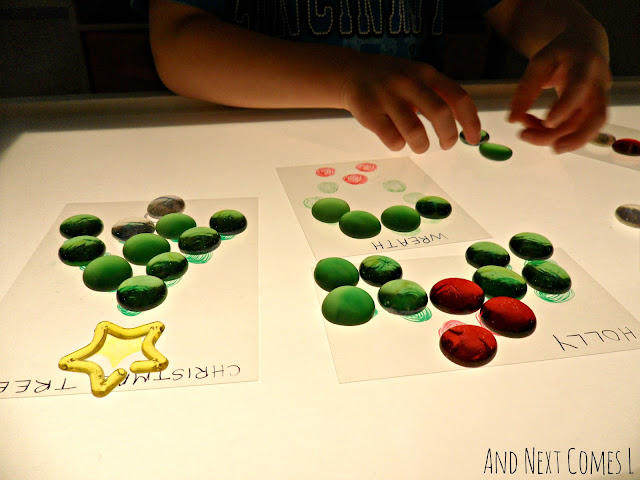 Christmas light table activity with glass stones
