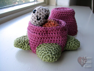 Amigurumi snail in his strawberry home