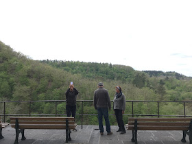 Hungarian tourists standing on a wall at Eltz Castle