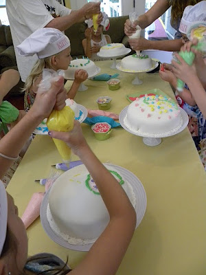 Of course the girls had to decorate a cakethis is a Cake Boss party 