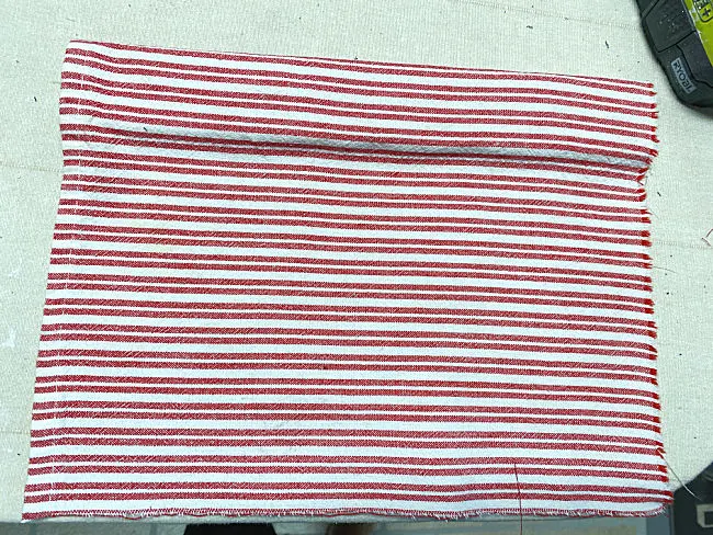 red and white fabric wrapped around wood