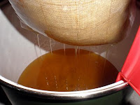 straining honey