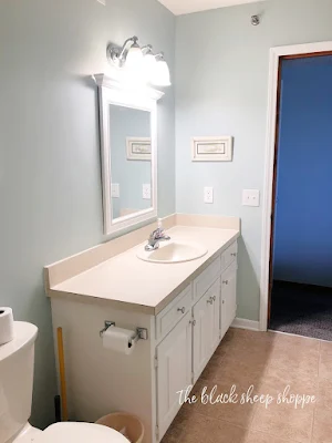 Blue walls and white vanity.