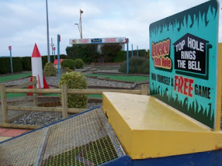 A view of the 9-hole Arnold Palmer Putting Course, a Rocket obstacle, and the Top Hole.