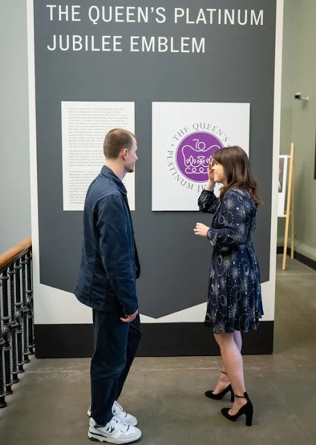 Princess Eugenie wore a navy ebony galaxy flippy dress from Whistles. the Queen's Jubilee Emblem Display at V&A Museum