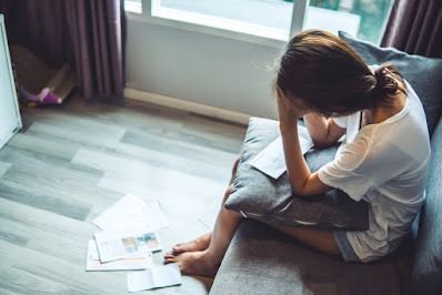 Woman stressing over medical bills