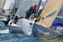 J/80 sailing crew at mark