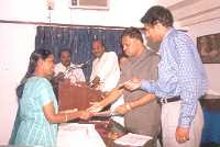Distribution of participation certificate by Dr K M Prabhu and Mr Anand of Aravind Foundation 