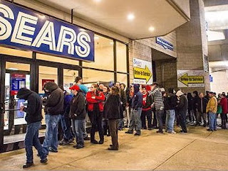 Sears black friday line day after Thanksgiving mall long lines customers waiting door busters