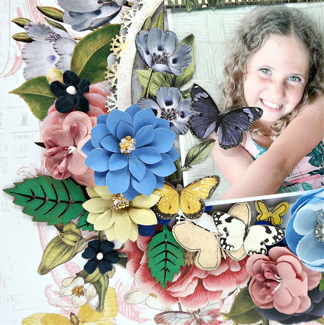 Shabby chic flower and butterfly scrapbook page using the Simple Stories Vintage Indigo Garden collection and chipboard from Creative Embellishments.