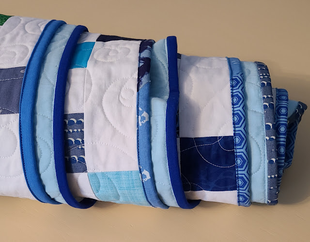 Scrappy blue quilt binding | DevotedQuilter.com