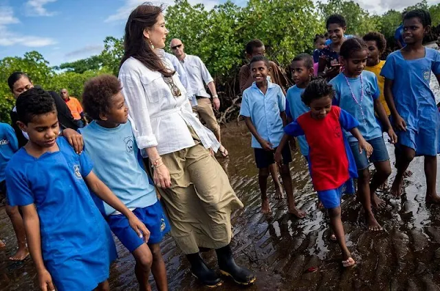 Princess Mary wore a white belted linen shirt by Ralph Lauren, and a Terrana green skirt from By Malene Birger