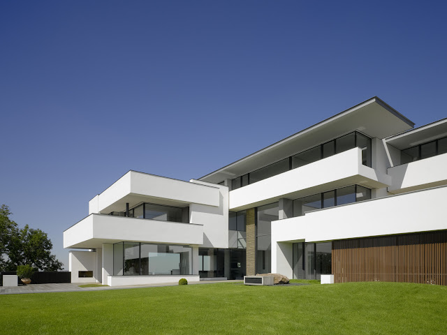 Photo of an amazing home as seen from the backyard