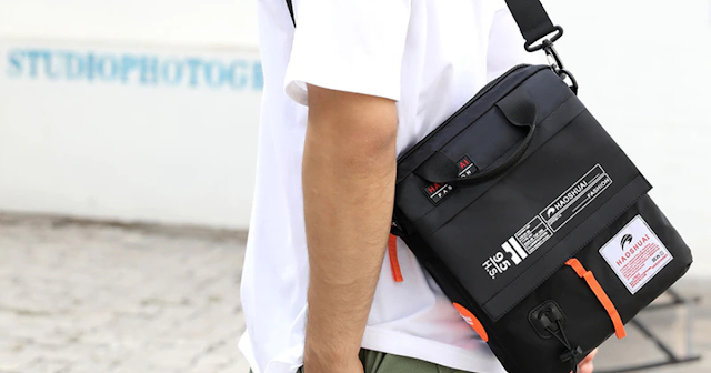 picture of a man carrying a boy's crossbody bag