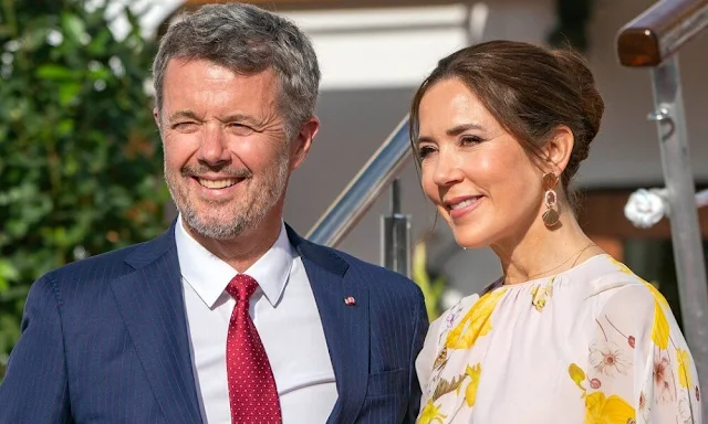 Crown Princess Mary wore a new cape-back floral-print silk-georgette blouse by Giambattista Valli. Rebekka Notkin