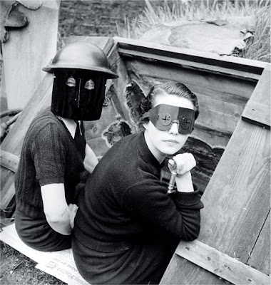 Lee Miller, Women with Fire Masks, Downshire Hill, London, 1941, black-and-white photograph