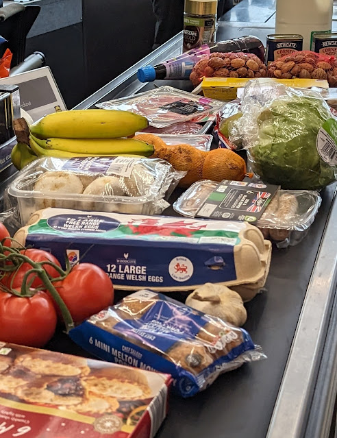 Supermarket checkout with groceries to be paid for
