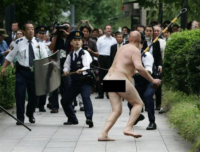 How many cops does it really take to capture a naked lunatic?