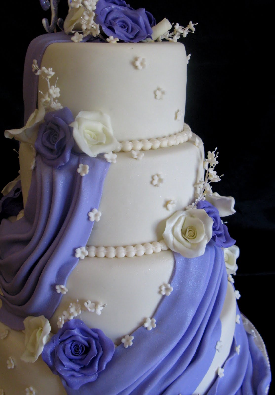 purple and yellow wedding cake with drape